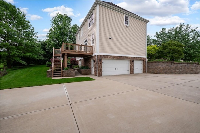 2214 Shannon Mills Dr, Connoquenessing Twp, PA 16053 - view of side of home featuring a garage, brick siding, stairs, driveway, and a lawn