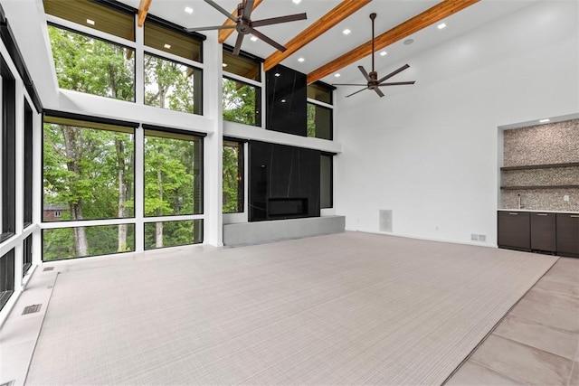 409 Fox Chapel Rd, Fox Chapel, PA 15238 - unfurnished living room featuring a ceiling fan, a high ceiling, beamed ceiling, and recessed lighting