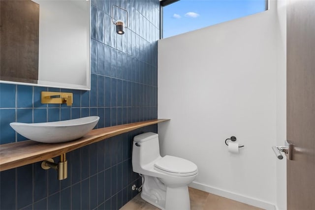 409 Fox Chapel Rd, Fox Chapel, PA 15238 - half bathroom featuring toilet and tile walls