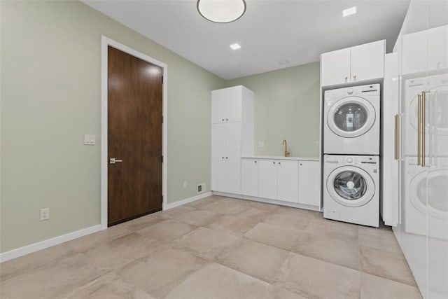 409 Fox Chapel Rd, Fox Chapel, PA 15238 - laundry area featuring estacked washer and dryer and baseboards