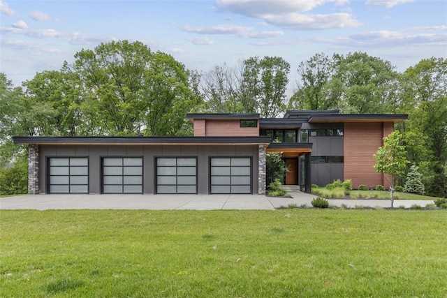 409 Fox Chapel Rd, Fox Chapel, PA 15238 - contemporary home featuring a front yard, stone siding, and driveway