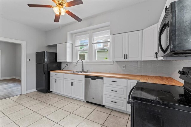 947 Pine St, Ambridge, PA 15003 - kitchen featuring black appliances, a sink, butcher block counters, and light tile patterned floors