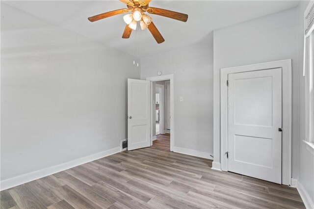 947 Pine St, Ambridge, PA 15003 - unfurnished bedroom featuring light wood-style floors, baseboards, and a ceiling fan