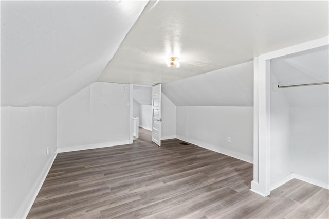 947 Pine St, Ambridge, PA 15003 - bonus room with baseboards, wood finished floors, and lofted ceiling