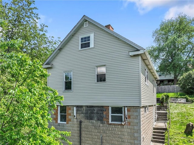 947 Pine St, Ambridge, PA 15003 - view of side of property with a chimney and stairs