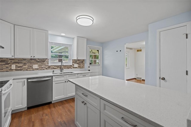 440 Perrymont, Mccandless, PA 15237 - kitchen featuring dishwasher, a sink, electric range, backsplash, and dark wood-style flooring