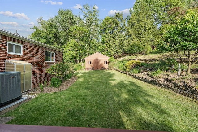 440 Perrymont, Mccandless, PA 15237 - view of grassy yard featuring central air condition unit and an outbuilding