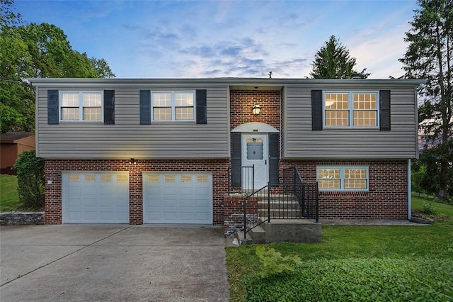 440 Perrymont, Mccandless, PA 15237 - split foyer home featuring an attached garage, concrete driveway, brick siding, and a front lawn