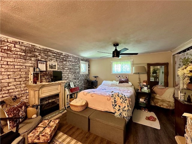 1641 Clintonville Rd, Irwin Twp, PA 16038 - bedroom featuring a textured ceiling, wood finished floors, brick wall, ornamental molding, and a ceiling fan
