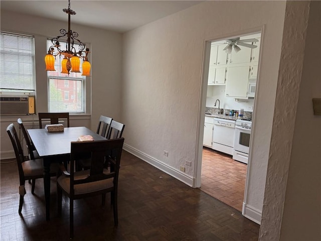 166 N Dithridge St Unit 2A, Oakland, PA 15213 - dining space with a textured wall, a chandelier, ceiling fan, baseboards, and cooling unit