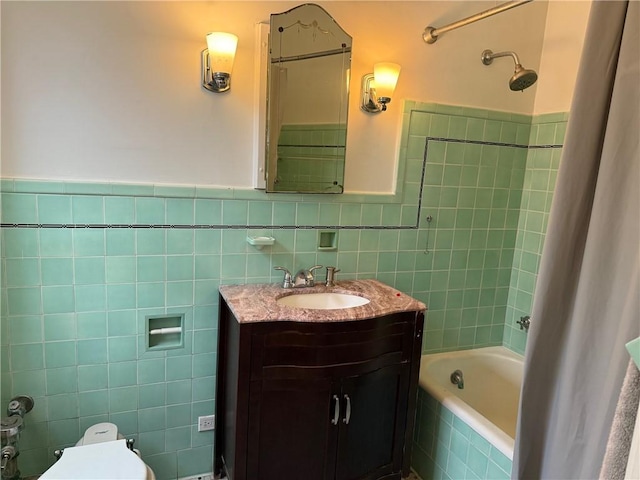 166 N Dithridge St Unit 2A, Oakland, PA 15213 - full bathroom with tile walls, vanity, tiled shower / bath, toilet, and a wainscoted wall