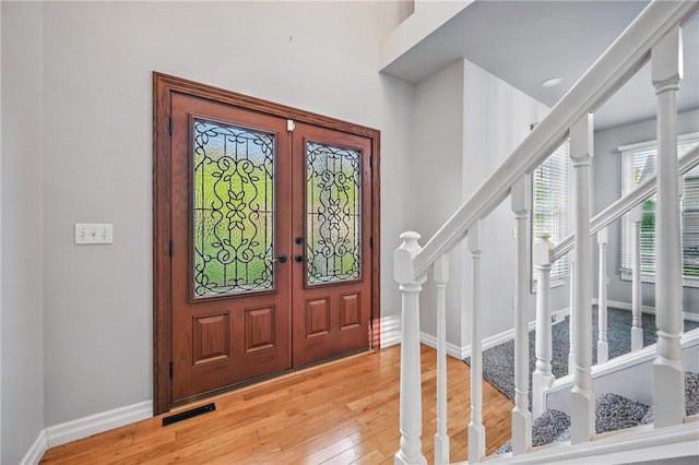 1523 Lori Ln, Hermitage, PA 16148 - foyer with french doors, stairs, light wood-type flooring, and baseboards