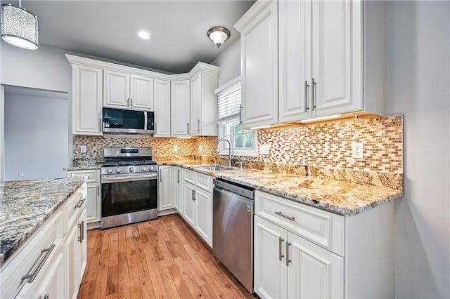1523 Lori Ln, Hermitage, PA 16148 - kitchen with stainless steel appliances, a sink, white cabinets, light wood-style flooring, and recessed lighting