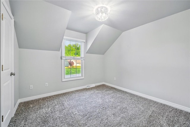 1523 Lori Ln, Hermitage, PA 16148 - additional living space featuring carpet, baseboards, vaulted ceiling, and a chandelier