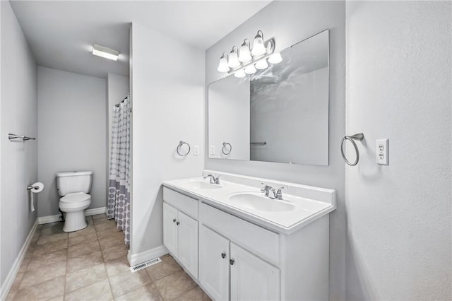 1523 Lori Ln, Hermitage, PA 16148 - full bath featuring double vanity, baseboards, toilet, and tile patterned flooring