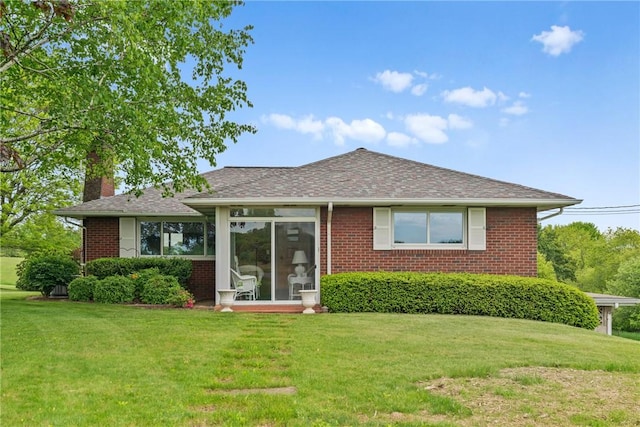 128 Wise Rd, City Of But Se, PA 16002 - back of property featuring a chimney, brick siding, and a yard
