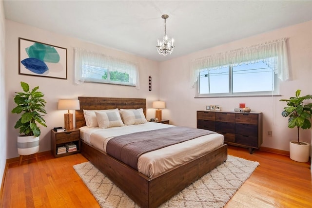 128 Wise Rd, City Of But Se, PA 16002 - bedroom featuring baseboards, light wood-style flooring, and a chandelier