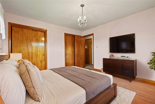 128 Wise Rd, City Of But Se, PA 16002 - bedroom featuring light wood finished floors, a chandelier, and baseboards