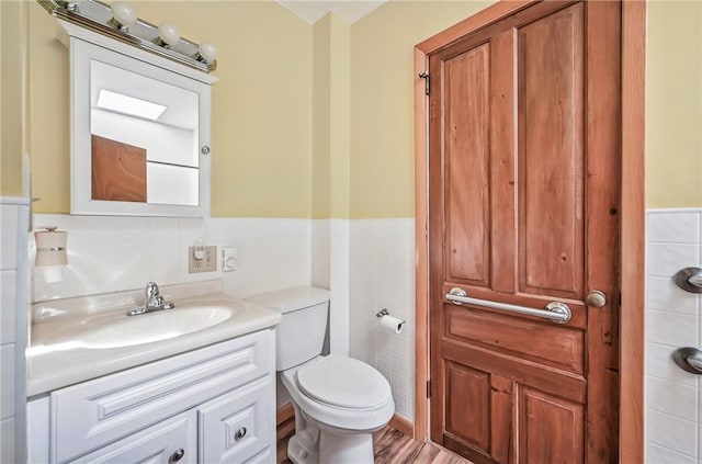 601 Depot St, Jamestown, PA 16134 - bathroom featuring vanity, toilet, and wainscoting