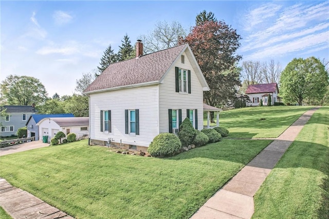 601 Depot St, Jamestown, PA 16134 - view of front facade featuring a chimney, a front lawn, roof with shingles, and a garage