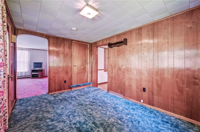 601 Depot St, Jamestown, PA 16134 - unfurnished room featuring arched walkways, carpet, and wooden walls
