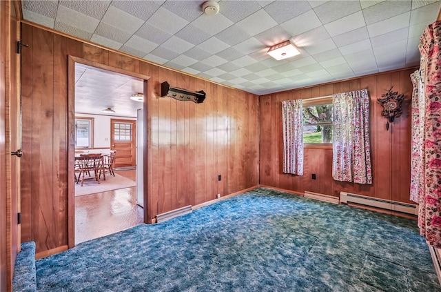 601 Depot St, Jamestown, PA 16134 - unfurnished room featuring baseboard heating, wood walls, and a smoke detector