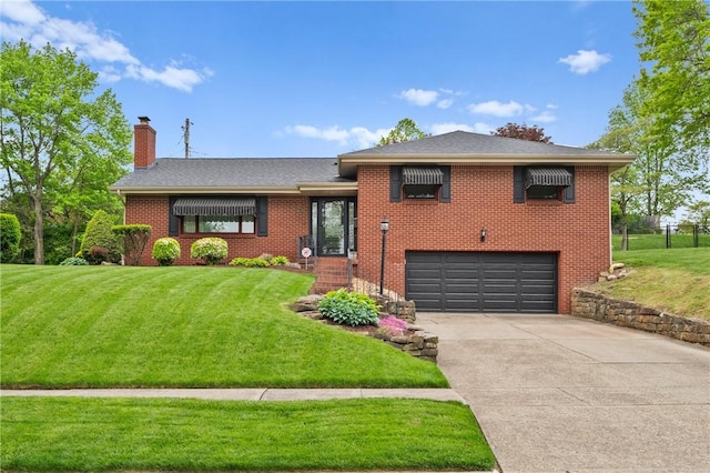 244 Elmtree Rd, New Kensington, PA 15068 - split level home with a chimney, an attached garage, driveway, and a front lawn