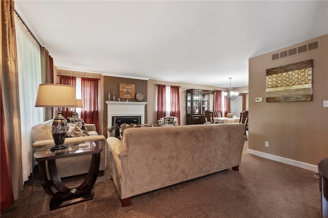 244 Elmtree Rd, New Kensington, PA 15068 - living area featuring a chandelier, healthy amount of natural light, a fireplace, and dark colored carpet