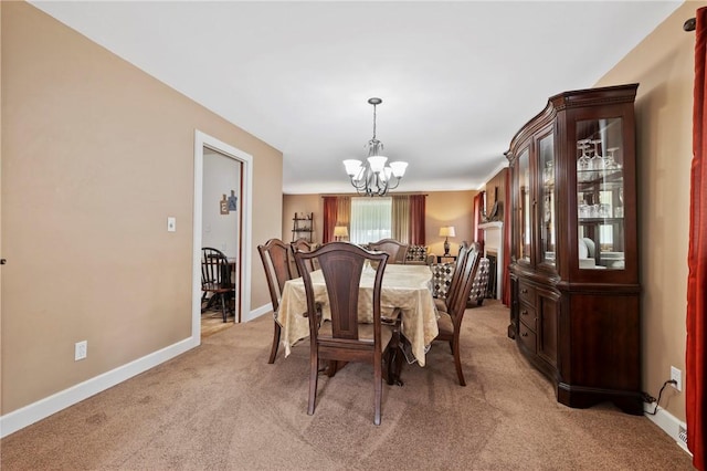 244 Elmtree Rd, New Kensington, PA 15068 - dining area with a chandelier, light colored carpet, and baseboards
