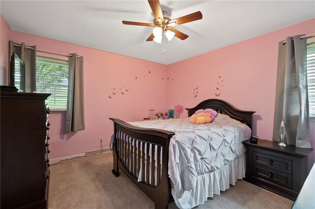 244 Elmtree Rd, New Kensington, PA 15068 - bedroom with light colored carpet, a ceiling fan, and baseboards