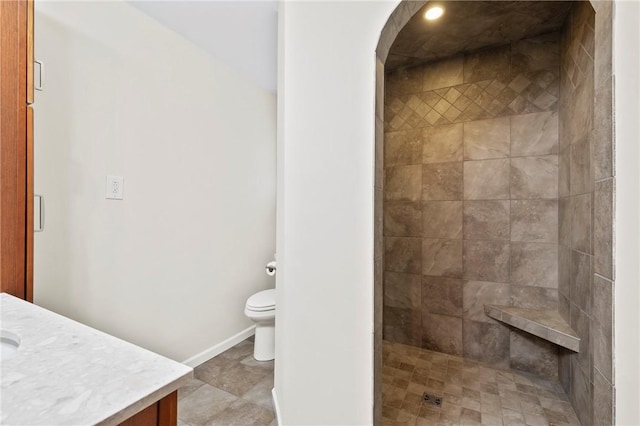 244 Elmtree Rd, New Kensington, PA 15068 - bathroom with tiled shower, toilet, vanity, and baseboards