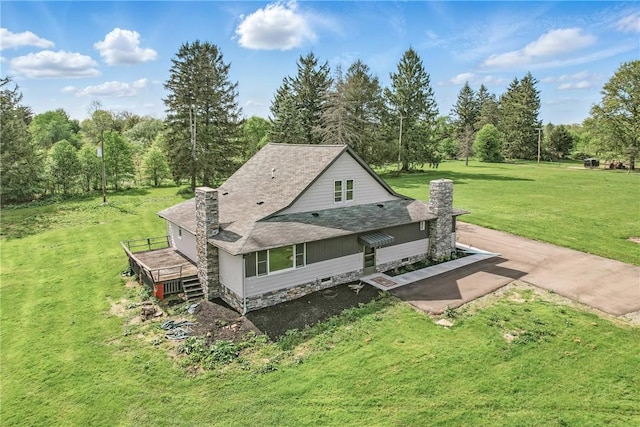 13035 State Highway 618, Conneaut Lake Cra, PA 16316 - rear view of house with a yard, roof with shingles, a chimney, and a wooden deck