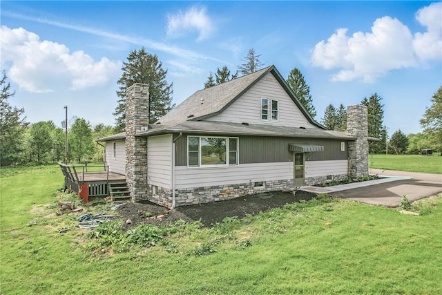 13035 State Highway 618, Conneaut Lake Cra, PA 16316 - view of side of property featuring a chimney, a wooden deck, a lawn, and roof with shingles