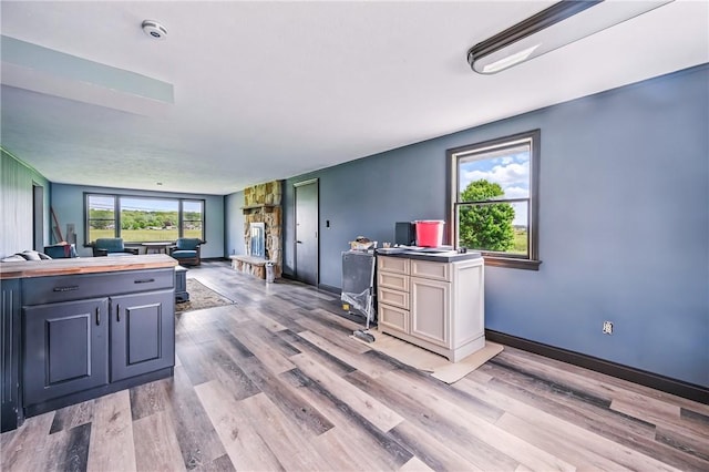 13035 State Highway 618, Conneaut Lake Cra, PA 16316 - kitchen featuring light wood-style floors, an office area, open floor plan, and baseboards