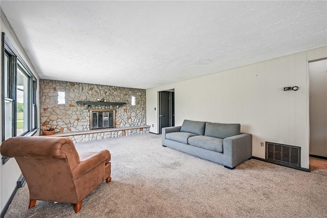 13035 State Highway 618, Conneaut Lake Cra, PA 16316 - carpeted living area with a textured ceiling, a fireplace, and baseboards