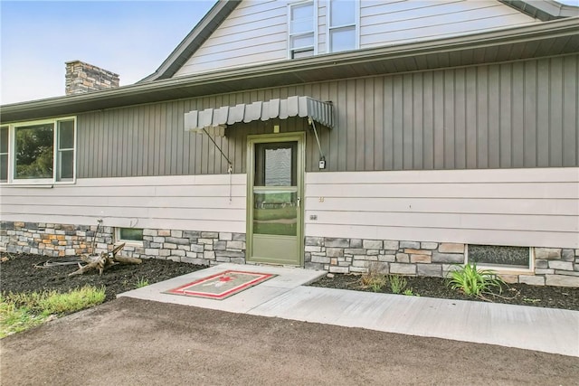 13035 State Highway 618, Conneaut Lake Cra, PA 16316 - view of exterior entry with a chimney