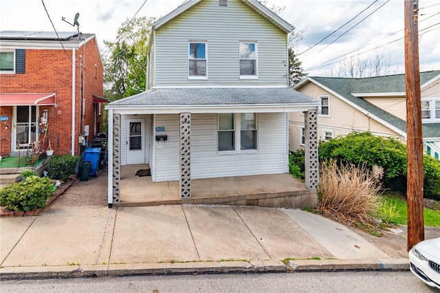 2605 Fayette St, Mckeesport, PA 15132 - traditional-style house with a porch and a shingled roof
