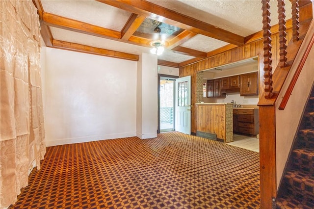 2605 Fayette St, Mckeesport, PA 15132 - kitchen with beamed ceiling, brown cabinetry, light countertops, coffered ceiling, and a sink