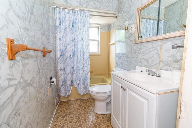 2605 Fayette St, Mckeesport, PA 15132 - bathroom featuring vanity, toilet, and shower / bath combo with shower curtain