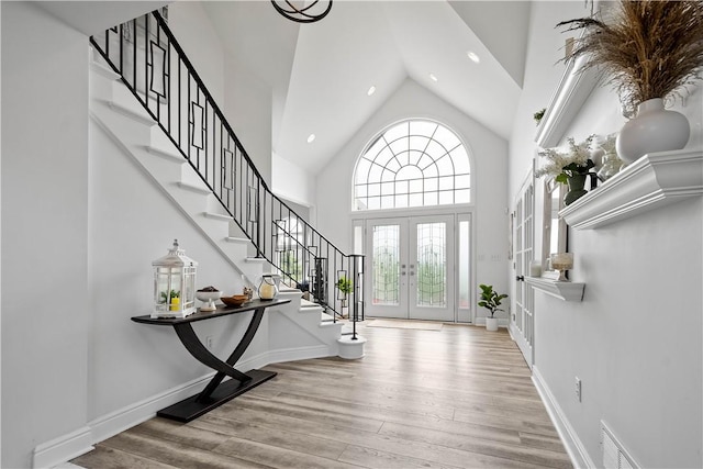 323 Snowberry Cir, Peters Twp, PA 15367 - entryway with stairway, high vaulted ceiling, wood finished floors, french doors, and recessed lighting