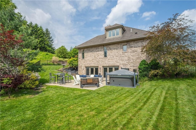 323 Snowberry Cir, Peters Twp, PA 15367 - rear view of house featuring an outdoor hangout area, a patio, brick siding, and a hot tub