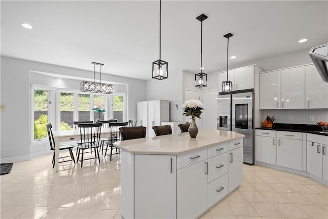 323 Snowberry Cir, Peters Twp, PA 15367 - kitchen featuring stainless steel refrigerator with ice dispenser, light tile patterned floors, white cabinets, decorative light fixtures, and recessed lighting