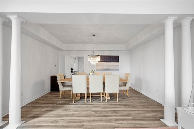 323 Snowberry Cir, Peters Twp, PA 15367 - dining area featuring wood finished floors, baseboards, a tray ceiling, ornamental molding, and a chandelier