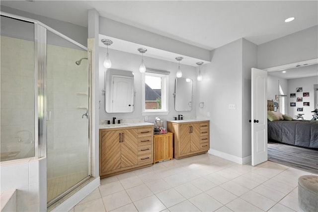 323 Snowberry Cir, Peters Twp, PA 15367 - ensuite bathroom with a stall shower, tile patterned flooring, two vanities, baseboards, and recessed lighting