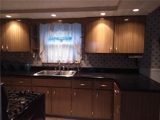 507 Bon Air Rd, Penn Hills, PA 15235 - kitchen featuring a sink, black gas stove, dark countertops, decorative backsplash, and recessed lighting