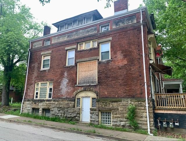 601 N Ave, Wilkinsburg, PA 15221 - view of front facade with a chimney and brick siding