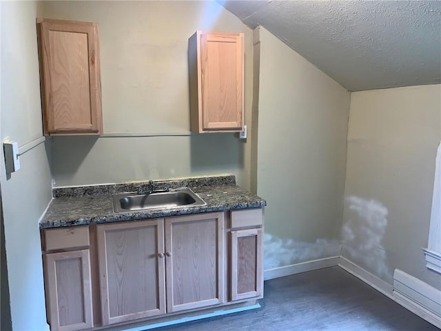 601 N Ave, Wilkinsburg, PA 15221 - kitchen with a sink, light brown cabinets, dark wood-type flooring, baseboards, and a textured ceiling