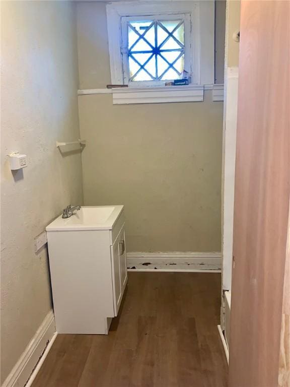 601 N Ave, Wilkinsburg, PA 15221 - bathroom featuring wood finished floors, vanity, and baseboards