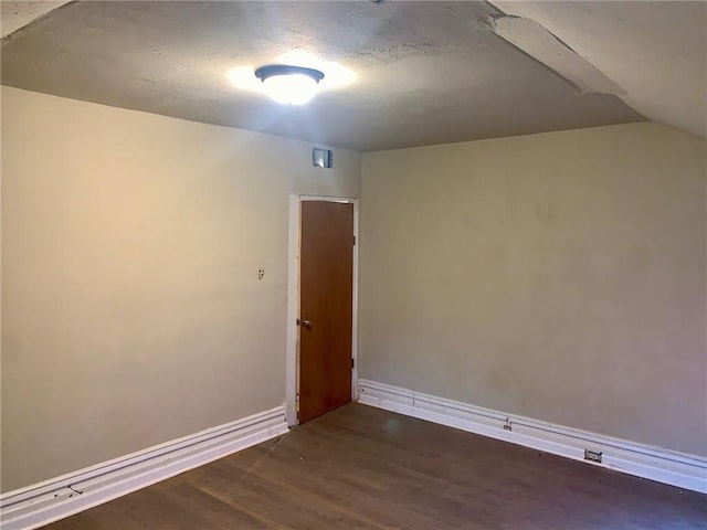 601 N Ave, Wilkinsburg, PA 15221 - empty room with baseboards, wood finished floors, and lofted ceiling