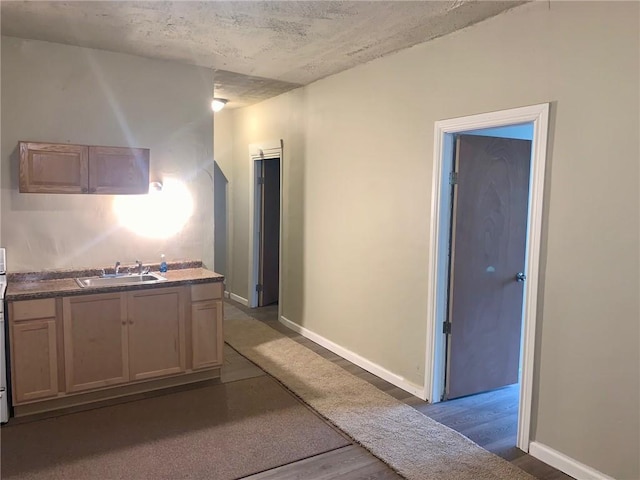 601 N Ave, Wilkinsburg, PA 15221 - kitchen with a sink, wood finished floors, and baseboards